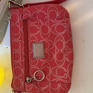 Pink and silver Coach wristlet